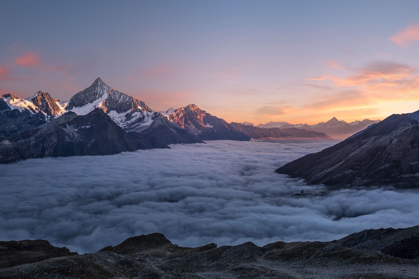 Layered Swiss peaks in soft morning light